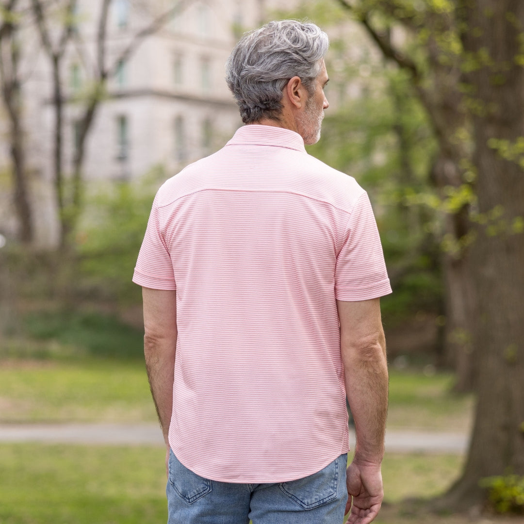 Adaptive Cooling Magnetic Front Short Sleeve Shirt in Coral Stripe worn by a man outdoors, back view.