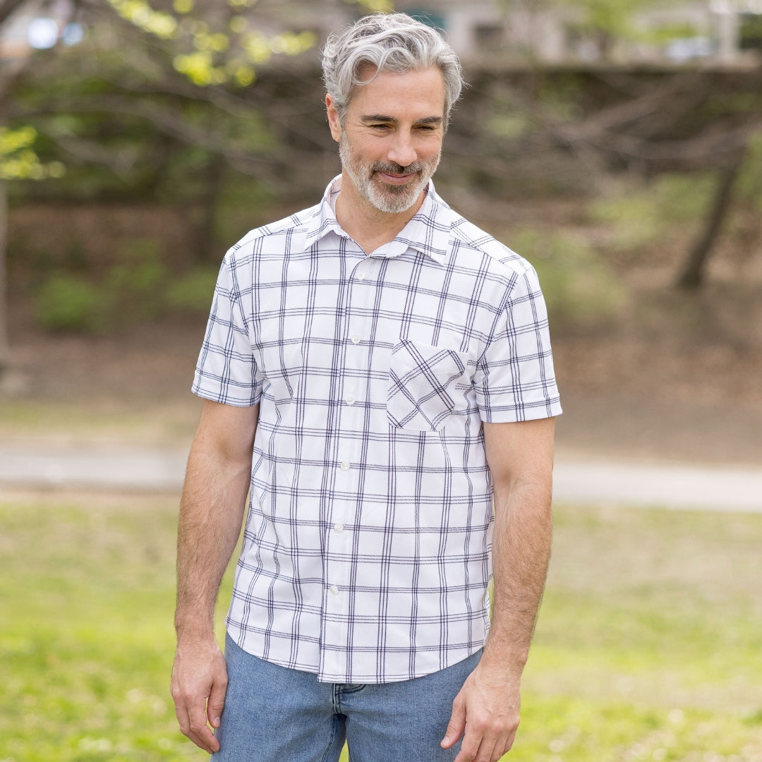 Adaptive Cooling Magnetic Front Short Sleeve Shirt in White Windowpane worn by a man outdoors, showcasing its stylish design.
