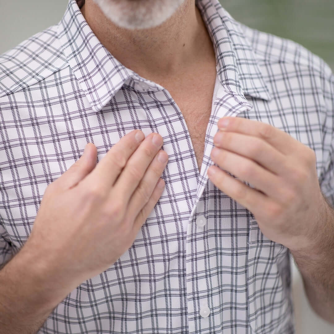 Adaptive cooling magnetic shirt with black and white grid pattern, designed for comfort and limited mobility support.