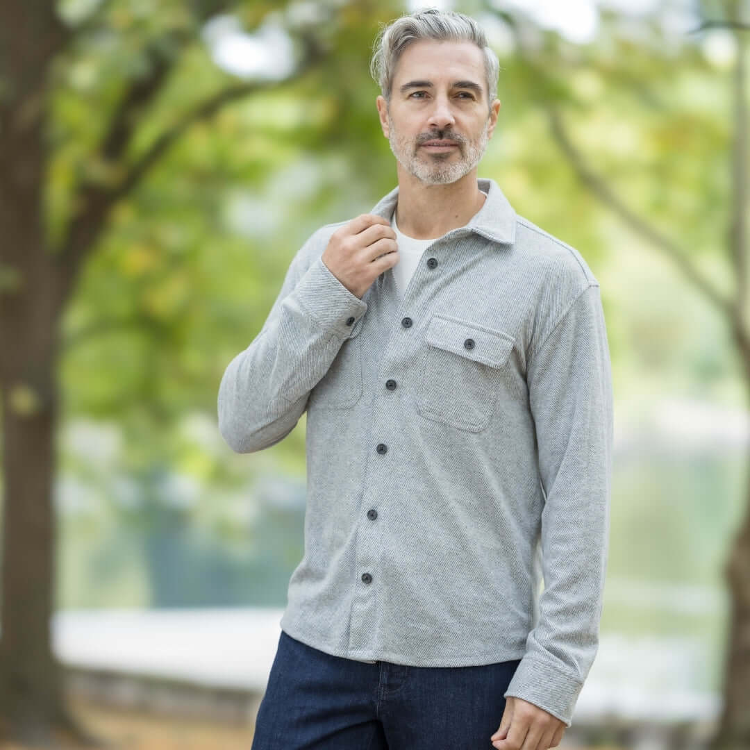 Men's adaptive grey flannel shirt jacket combo, featuring magnetic closures, in a natural outdoor setting.