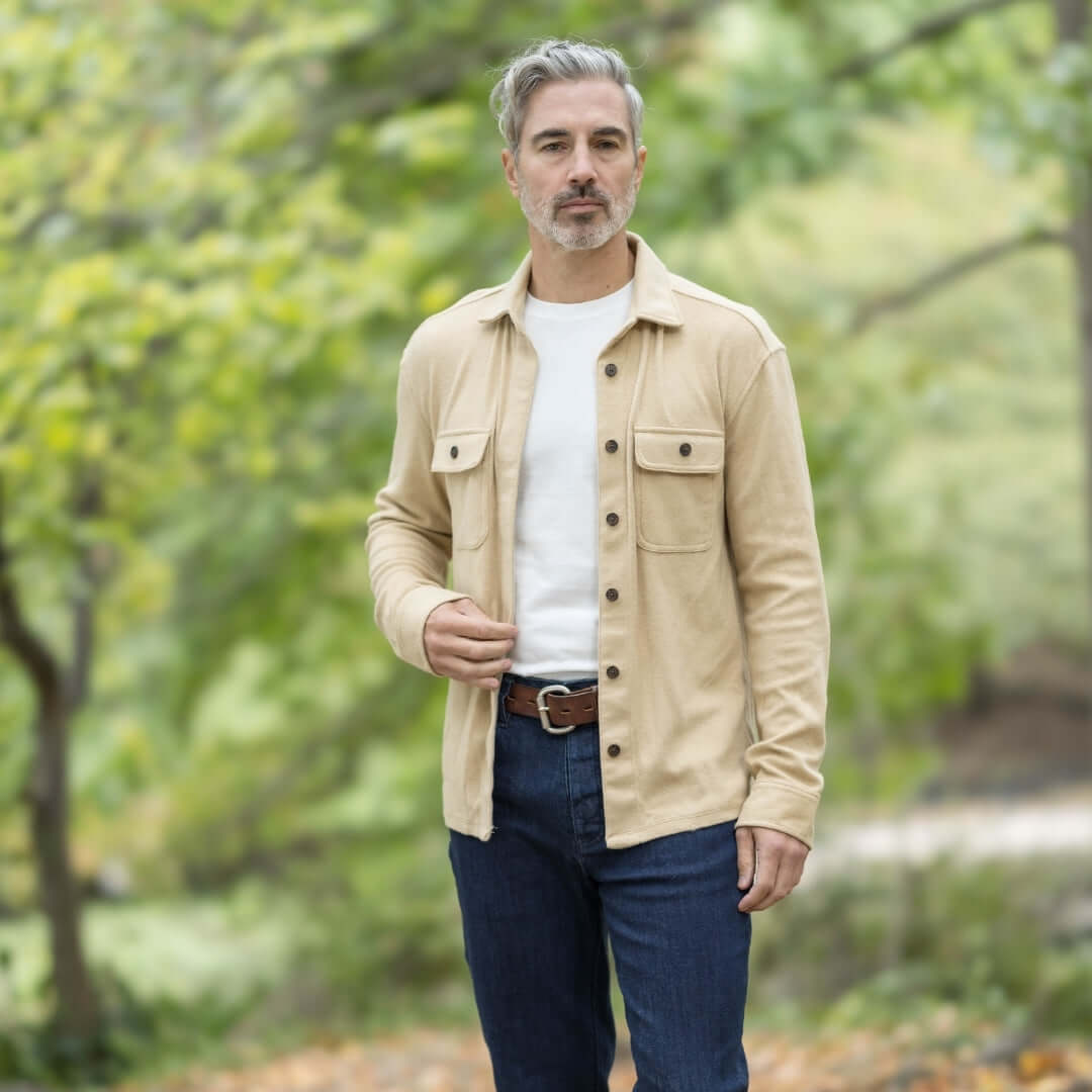 Men's khaki flannel shirt jacket combo worn outdoors, perfect for layering in changing seasons.
