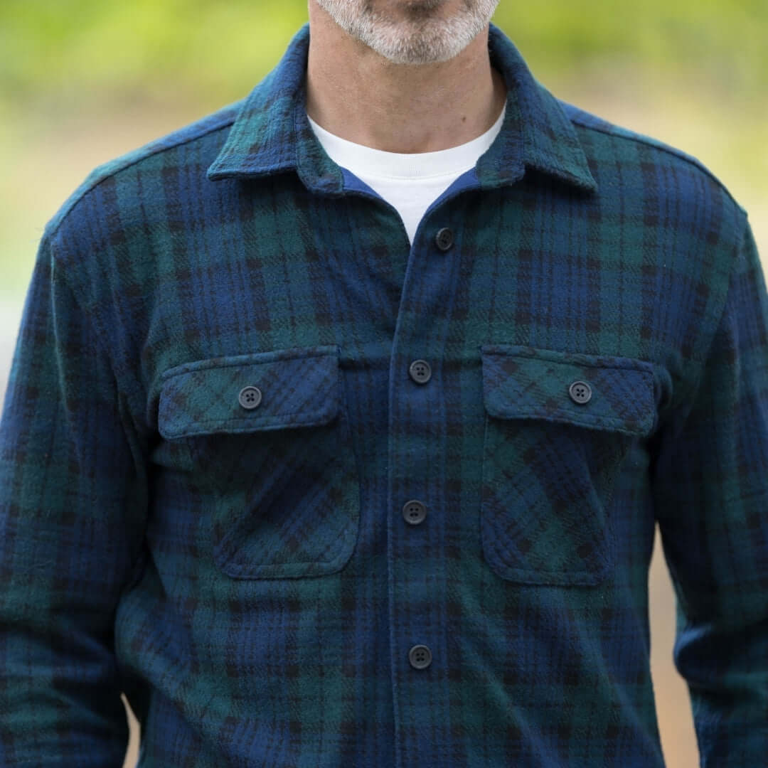 Men's adaptive navy and green check flannel shirt with buttoned pockets, perfect for layering in cooler seasons.
