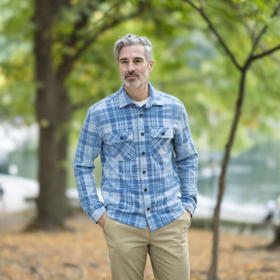 Men's adaptive pale blue plaid flannel shirt, perfect for layering and functionality in changing seasons.