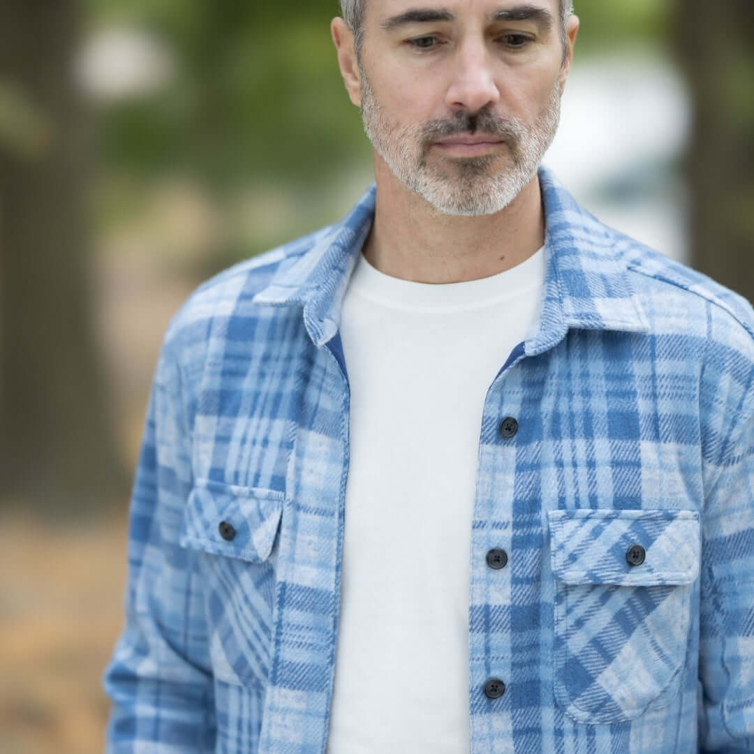 Men's adaptive pale blue plaid flannel shirt, perfect for layering in changing seasons, featuring a stylish design.
