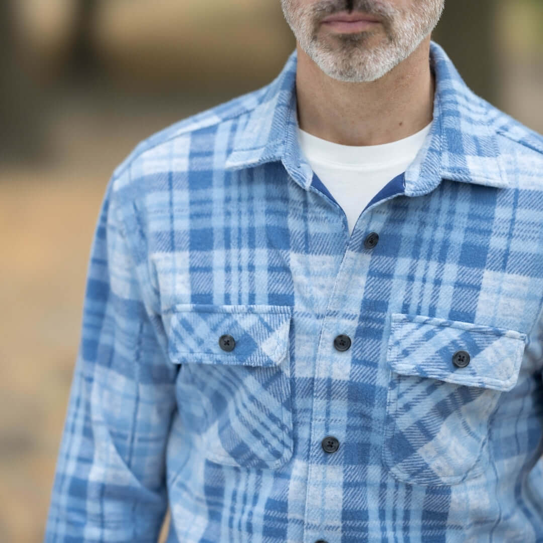 Men's adaptive pale blue plaid flannel shirt with magnetic closures, perfect for layering during seasonal changes.