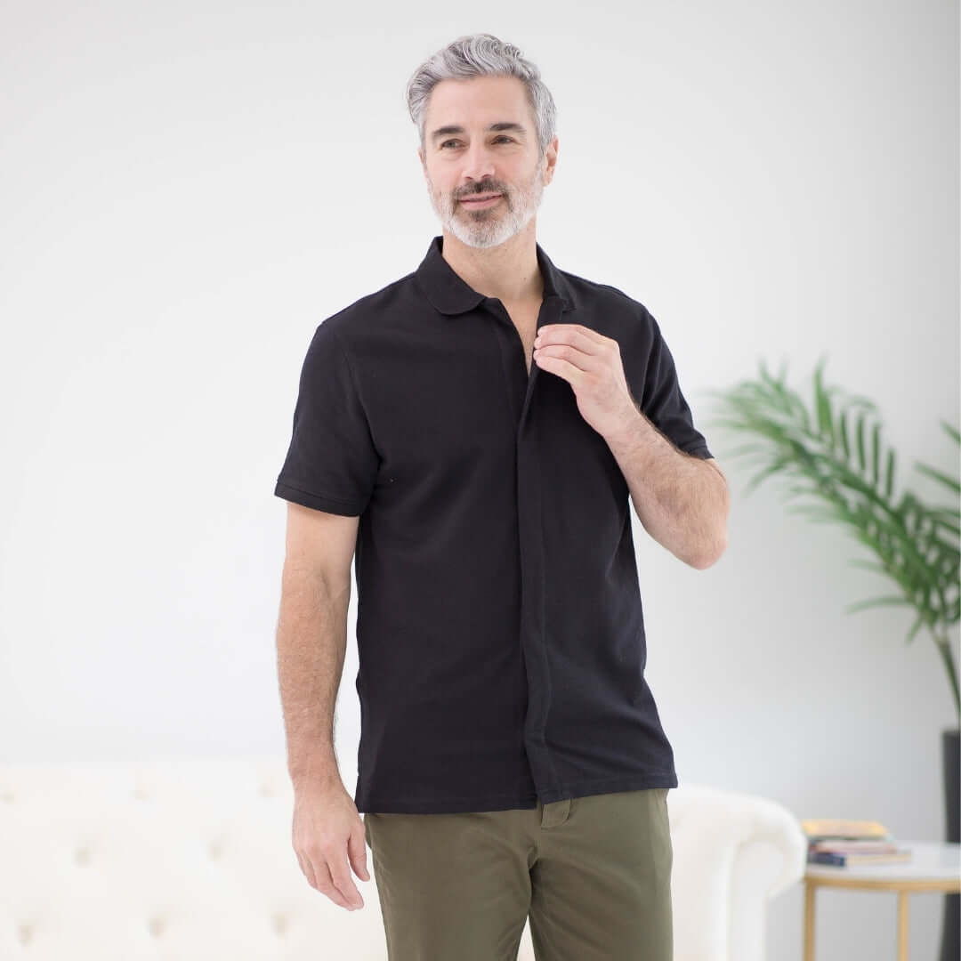 Black pique knit short sleeve polo with magnetic closures, ideal for easy dressing and comfort.