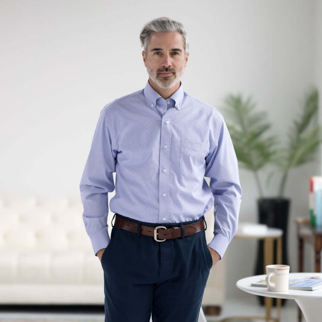 Man in blue and green check long sleeve button-down shirt with magnetic closures, showcasing classic and modern style.