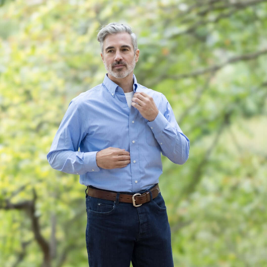Blue long sleeve button down collar shirt with magnetic closures, ideal adaptive clothing for ease of dressing.