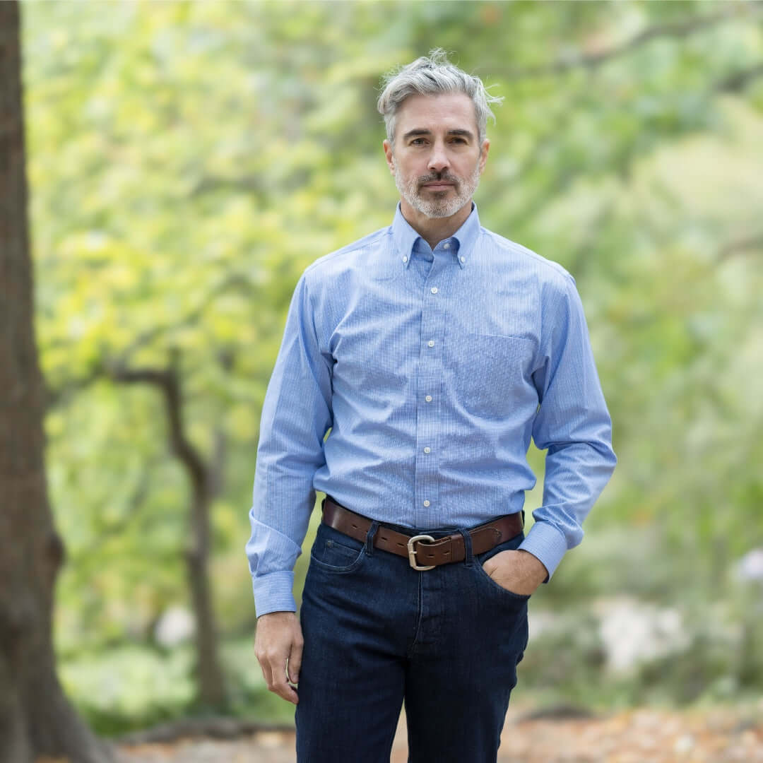 Blue long sleeve button down shirt with magnetic closures, designed for ease of dressing and adaptive clothing.