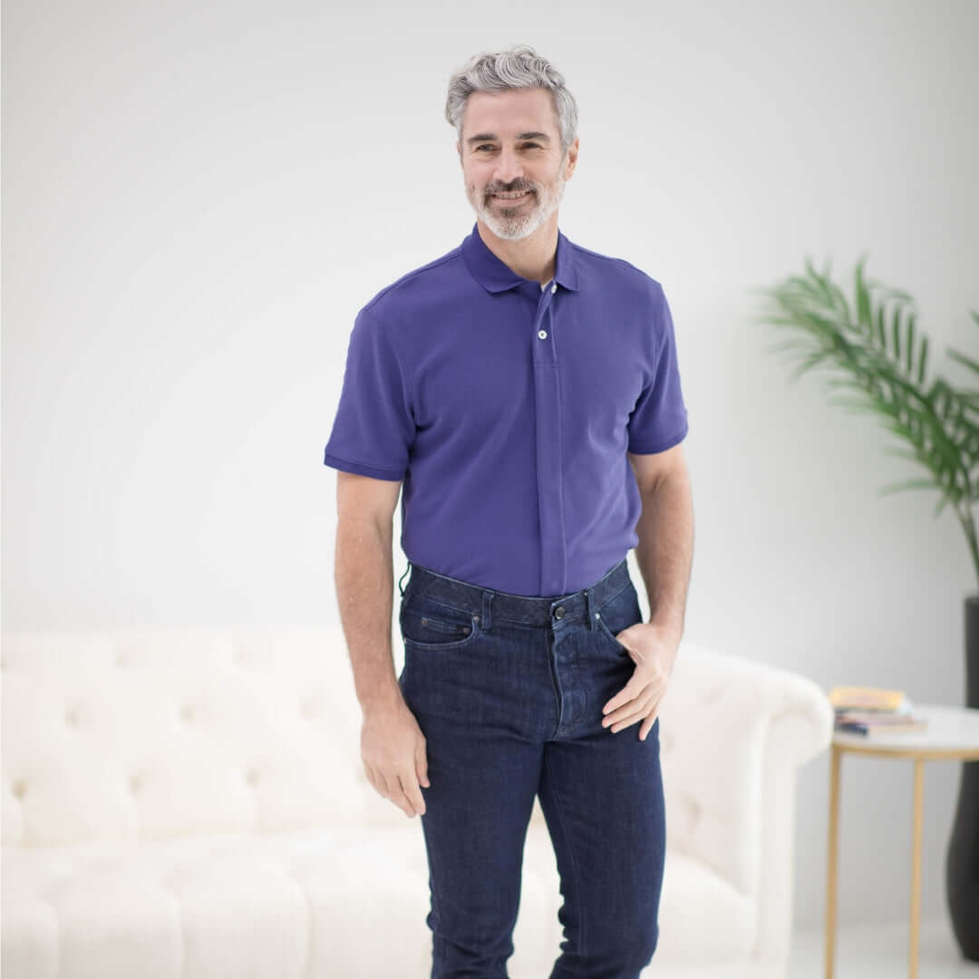 Comfortable blue pique knit polo shirt with magnetic closures for easy dressing, styled for individuals with accessibility needs.
