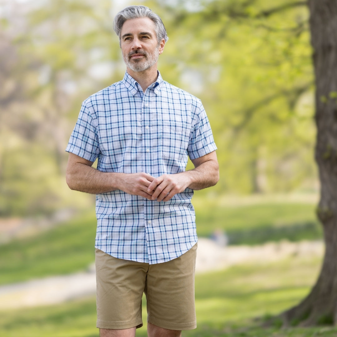 Blue Plaid Short Sleeve Shirt with Magnetic Closures worn by a man outdoors in a park setting.