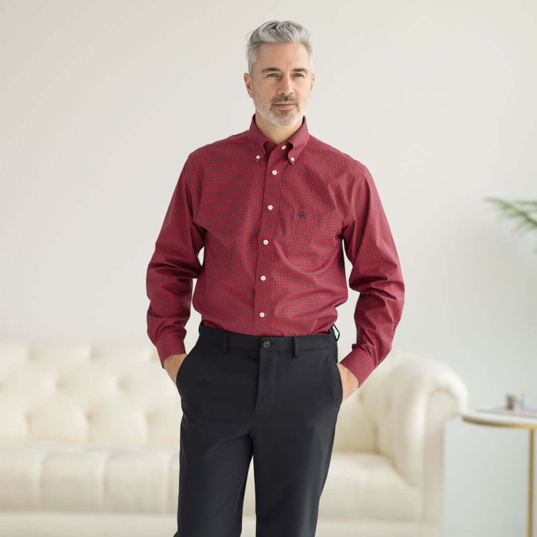 Brooks Brothers x MagnaReady stretch long sleeve tartan plaid button-down shirt with magnetic closures modeled by a man.