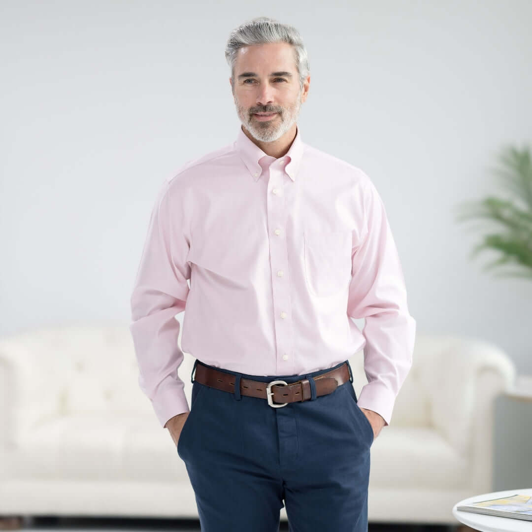 Brooks Brothers MagnaReady pink polo shirt model wearing button-down collar with magnetic closures.