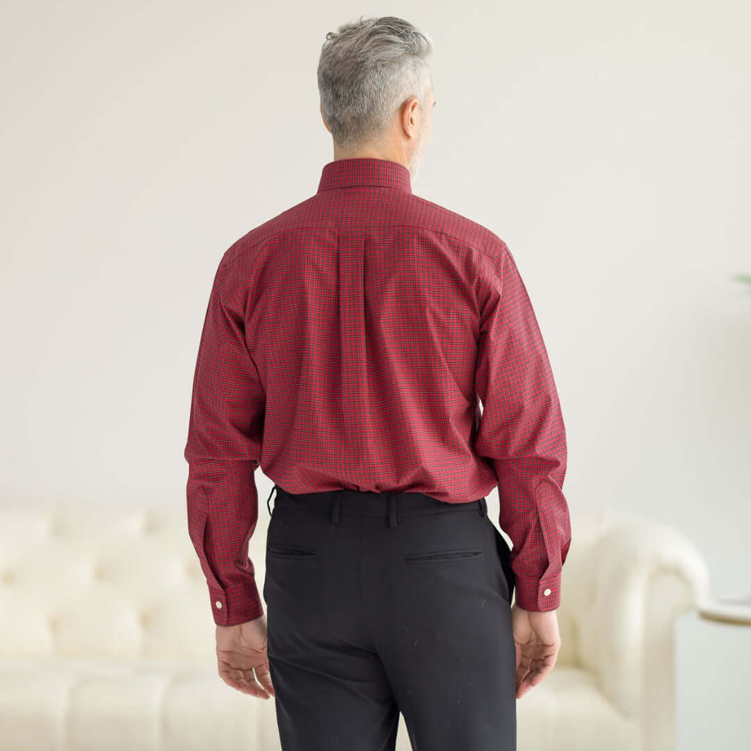 Back view of a man wearing a Brooks Brothers x MagnaReady long sleeve tartan plaid shirt with magnetic closures.