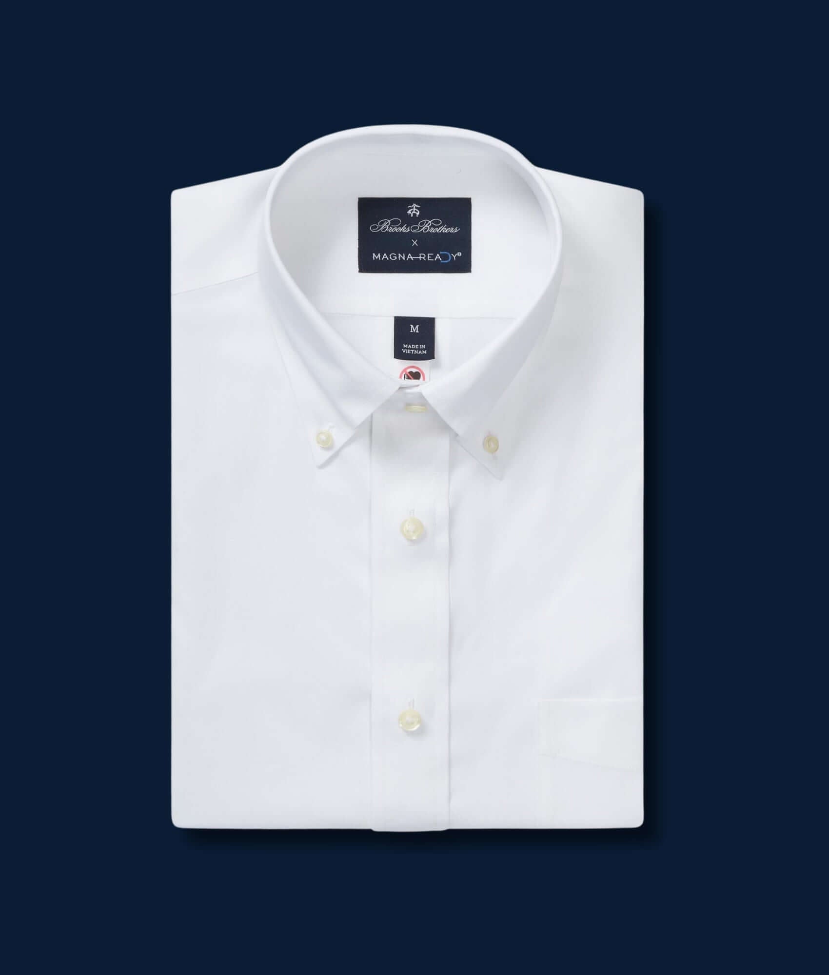 Brooks Brothers x MagnaReady white polo button-down collar shirt with magnetic closures, showcasing classic style and adaptive technology.