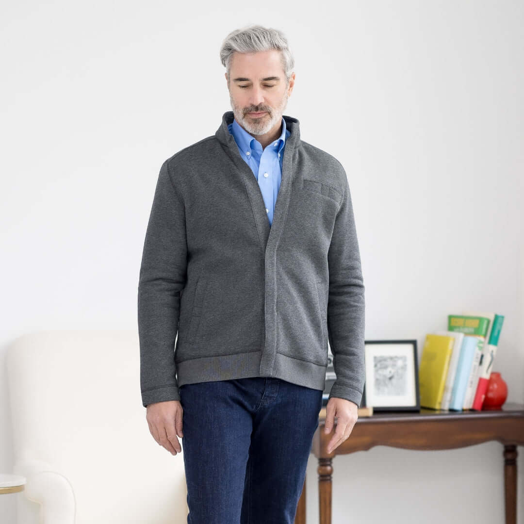 Man in gray Dillon Magnetic Closure Fleece Jacket, showcasing adaptive style and comfort for easy wear.