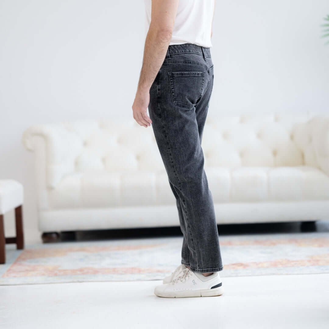 Man wearing denim black wash five pocket jeans with magnetic fly, showcasing comfort and style.