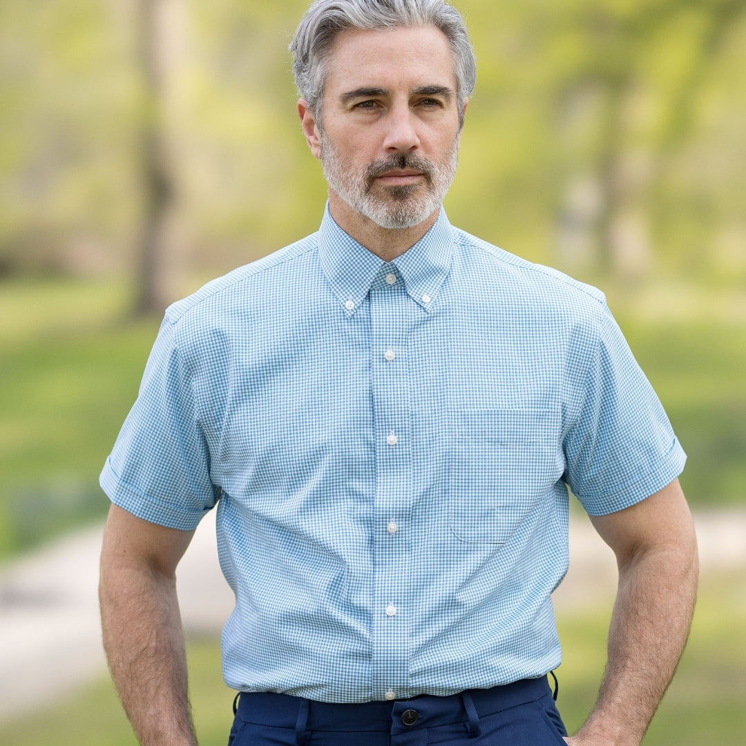 Green and Blue Check Short Sleeve Shirt with Magnetic Closures worn by a man outdoors.