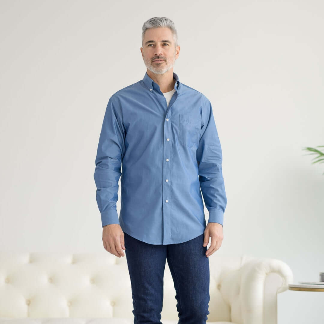 Man wearing a long sleeve blue chambray shirt with magnetic closures, ideal for adaptive fashion.