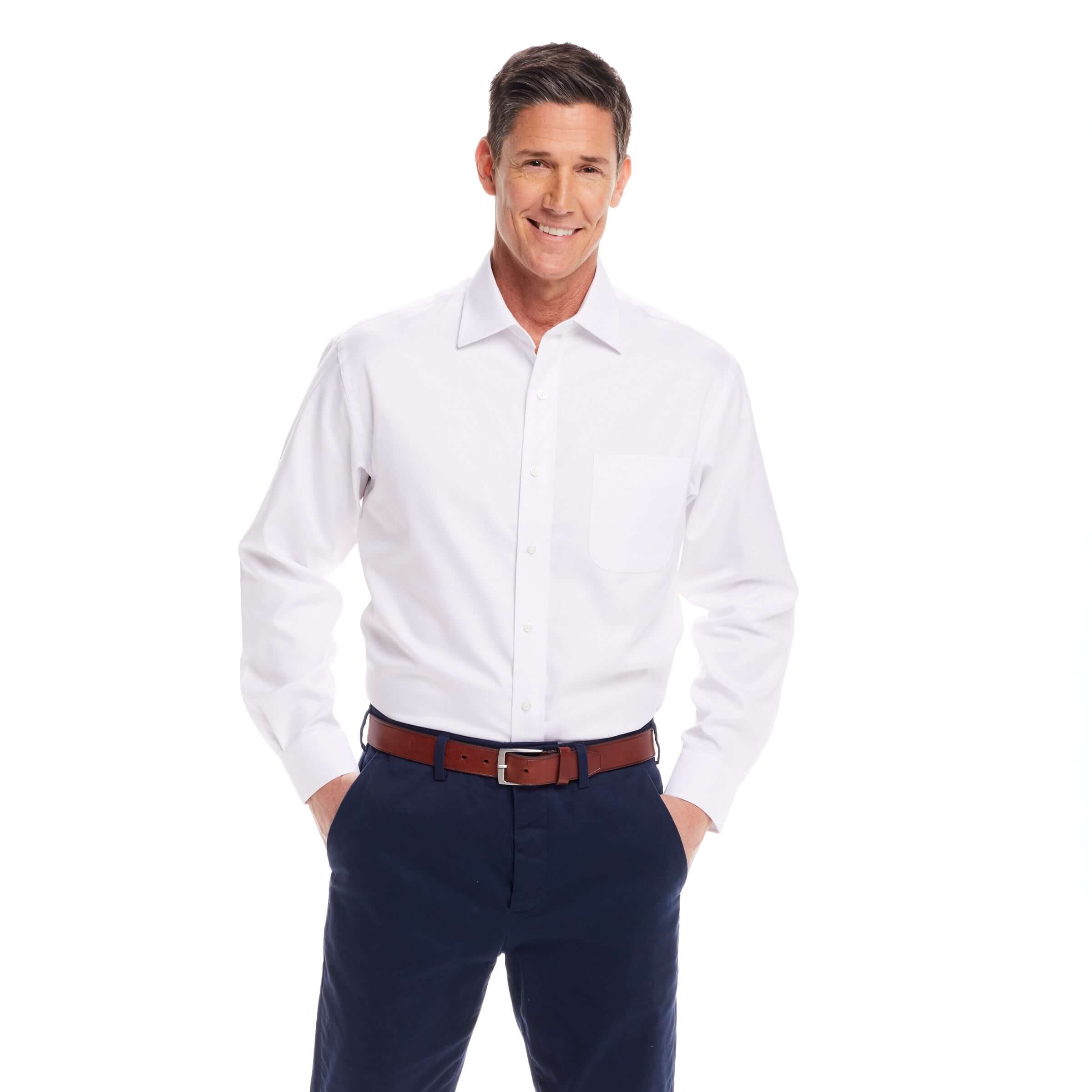 Model wearing a classic long sleeve white 'Ryan' dress shirt with magnetic closures, styled for comfort and elegance.