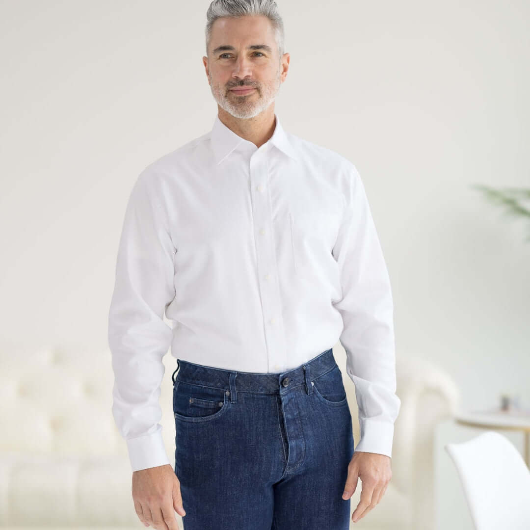 Model wearing a Long Sleeve White ‘Ryan’ Dress Shirt with Magnetic Closures, styled with jeans.