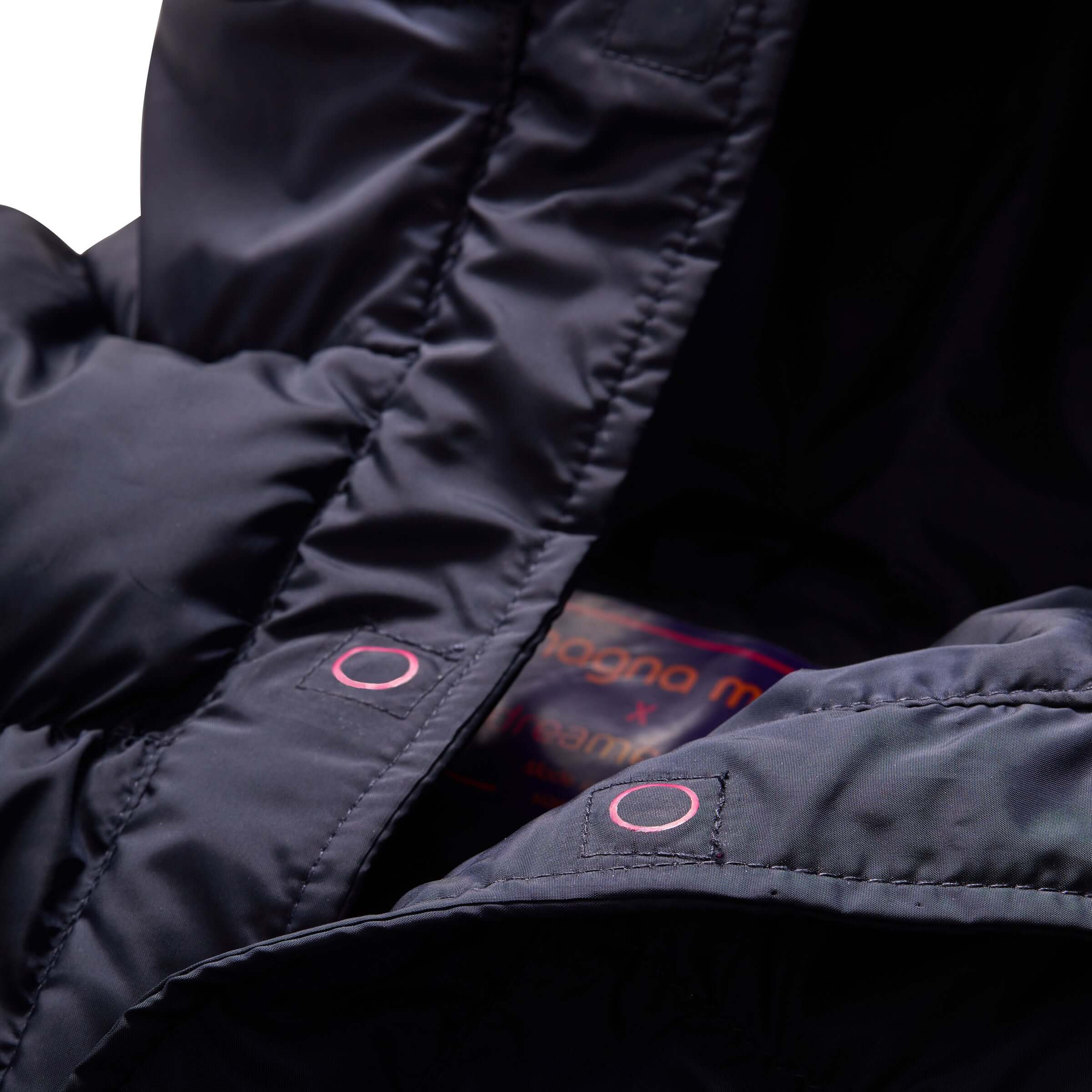 Close-up of the Navy MagnaMini Kids Magnetic Puffer Coat interior with magnet guides and cozy fabric.