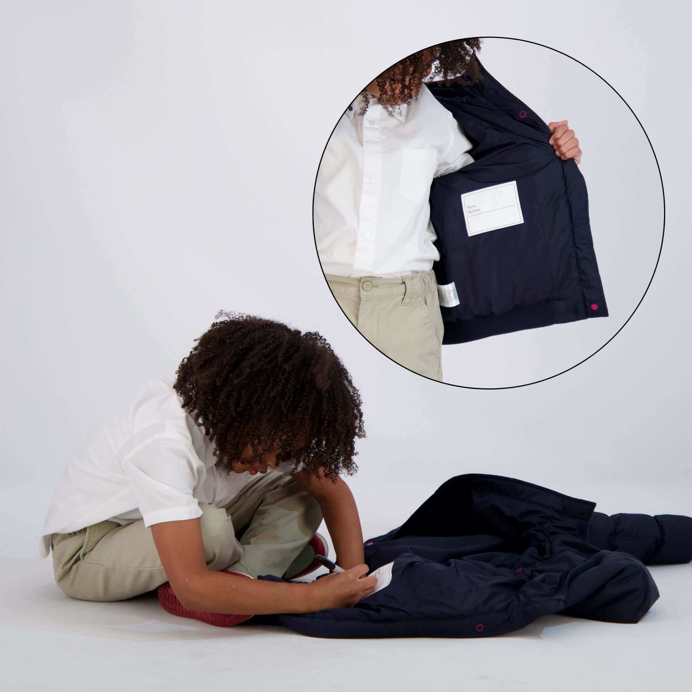 Child using MagnaMini Kids Magnetic Puffer Coat, highlighting easy dressing with inner magnet guides.