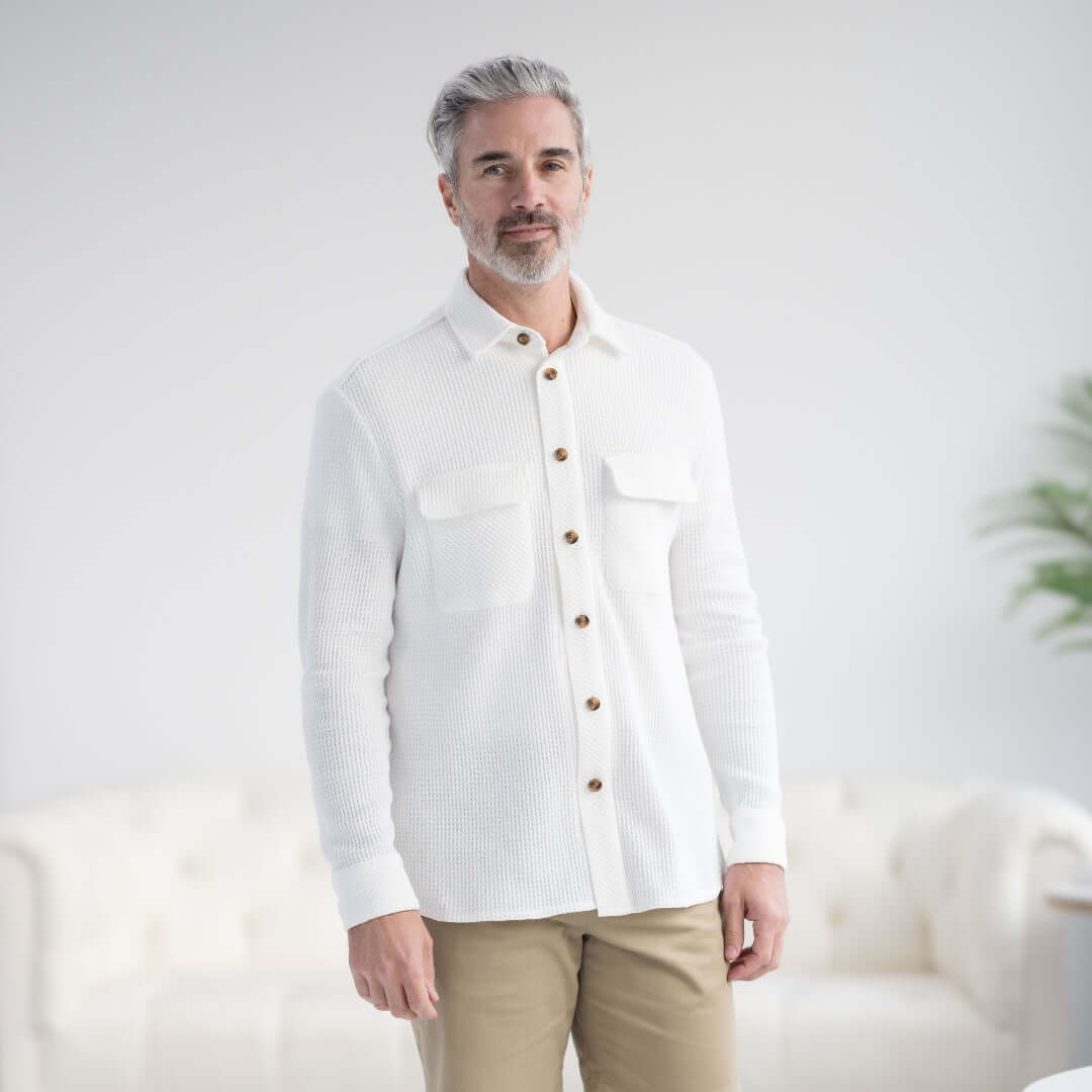 Man wearing a white waffle weave casual shirt with oversized pockets and button front.