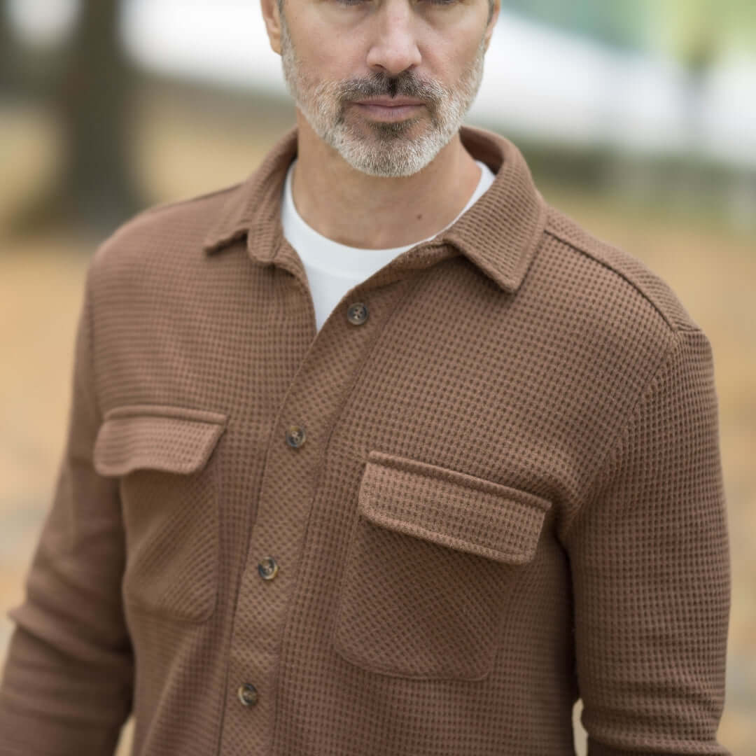 Man wearing Magnetic Front WaffleWeave Casual Shirt with dual pockets in Choco color, showcasing comfort and style.