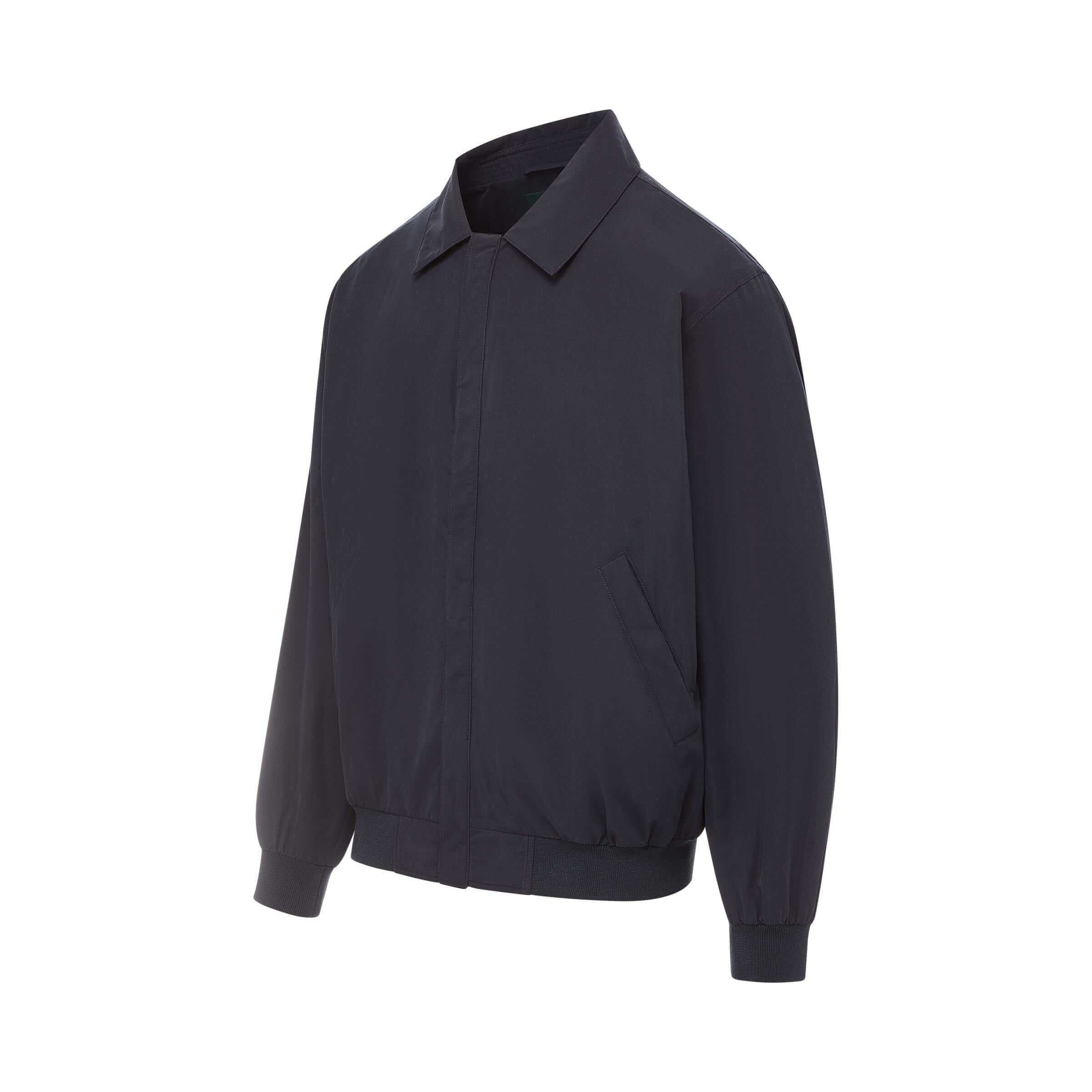 MagnaReady® X Weatherproof Navy Golf Jacket featuring patented magnetic closures for adaptive wear.