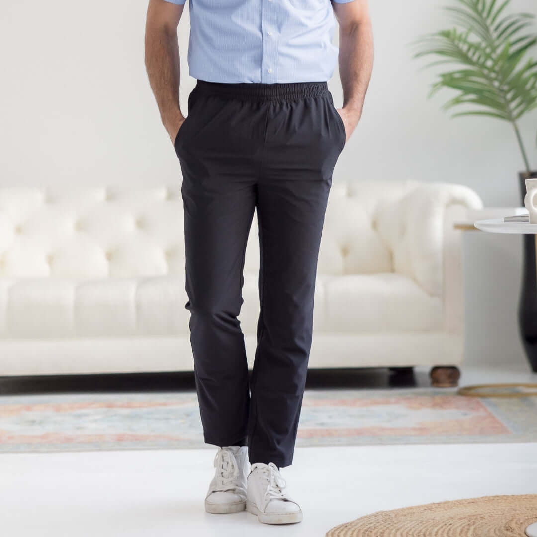 Men's adaptive black elastic waist track pants, perfect for casual wear and active lifestyles, featuring a sleek design.