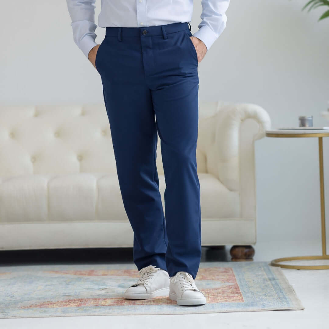 Nautica x MagnaReady adaptive fly stretch dress pants in navy, styled with a button-up shirt and white sneakers.