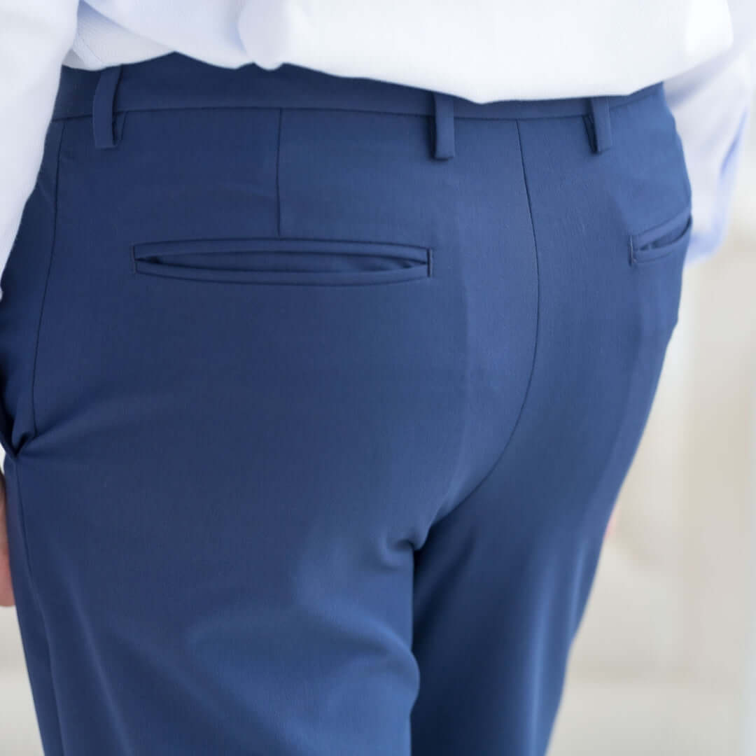 Rear view of Nautica® x MagnaReady® adaptive fly stretch dress pant in navy, showcasing tailored design and modern fit.