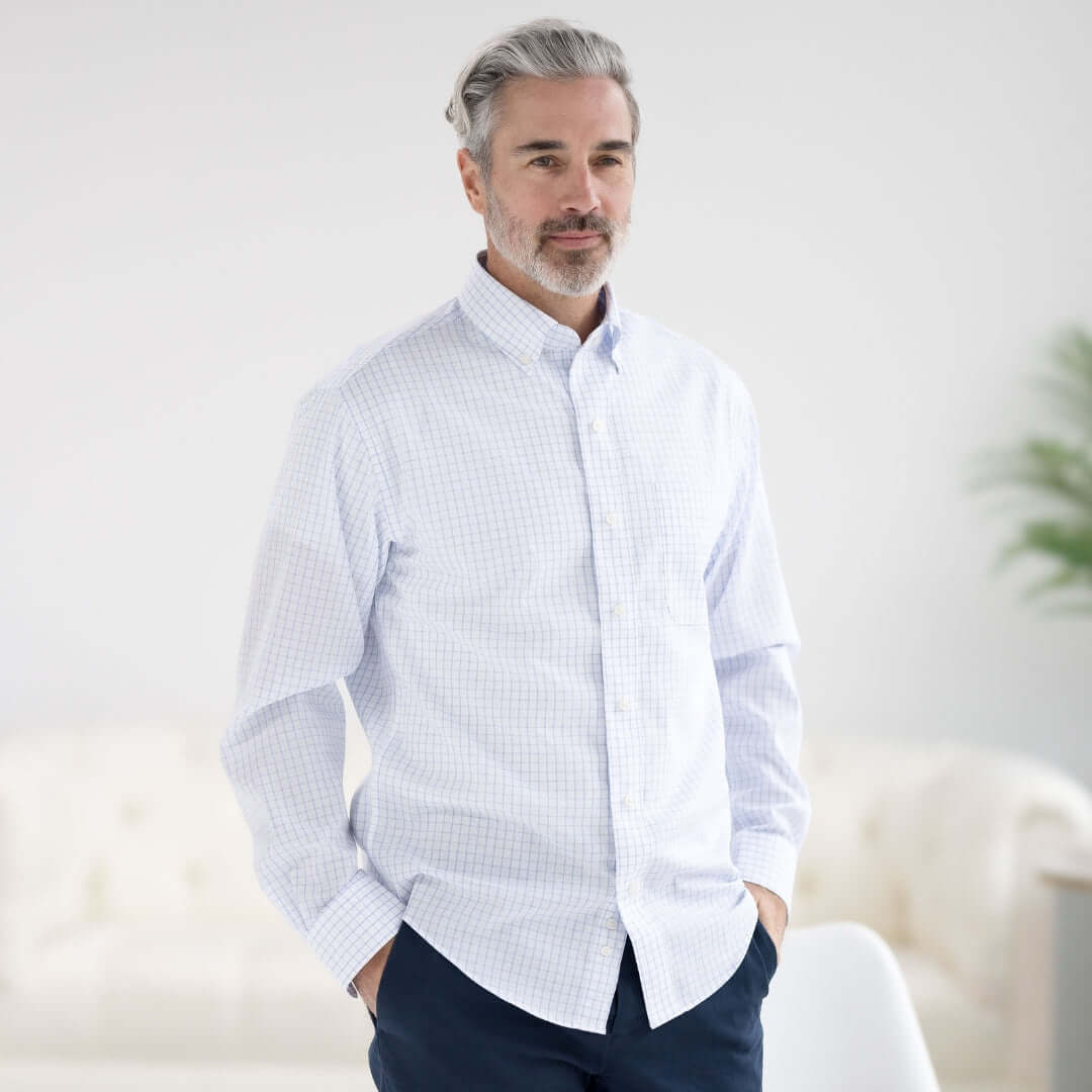 Man wearing a Navy Grid Long Sleeve Heights Button Down Shirt with magnetic closures, showcasing adaptive menswear style.