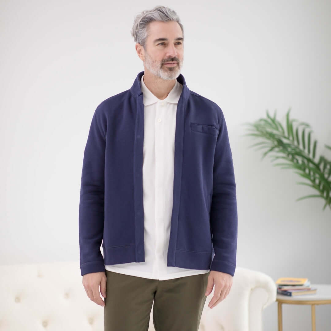 Man wearing a Navy Knit Fleece Long Sleeve Dillon Jacket with Magnetic Closures, featuring a stylish and modern design.