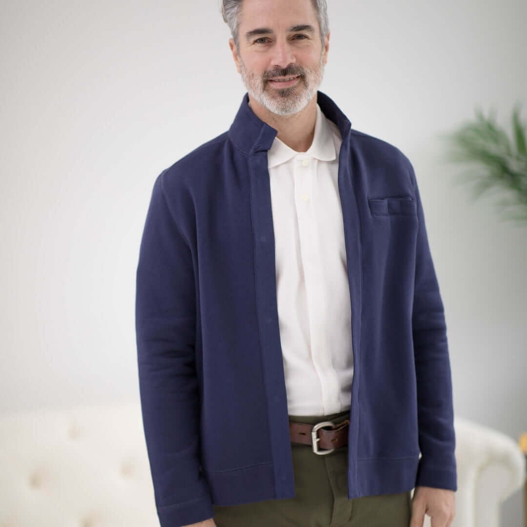Man wearing a navy knit fleece Dillon jacket with magnetic closures for comfort and style.