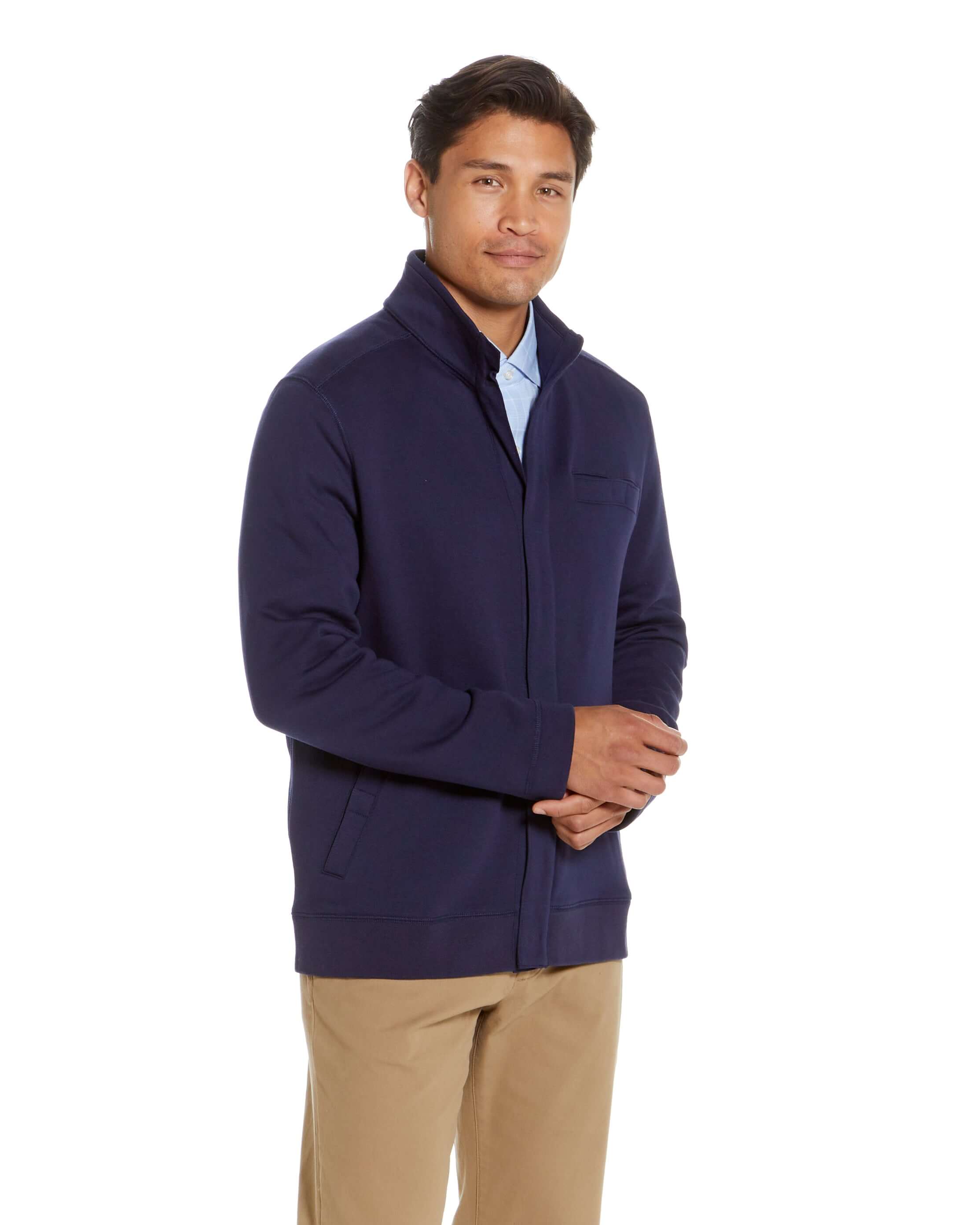 Man wearing navy knit fleece 'Dillon' jacket with magnetic closures, showcasing style and comfort.