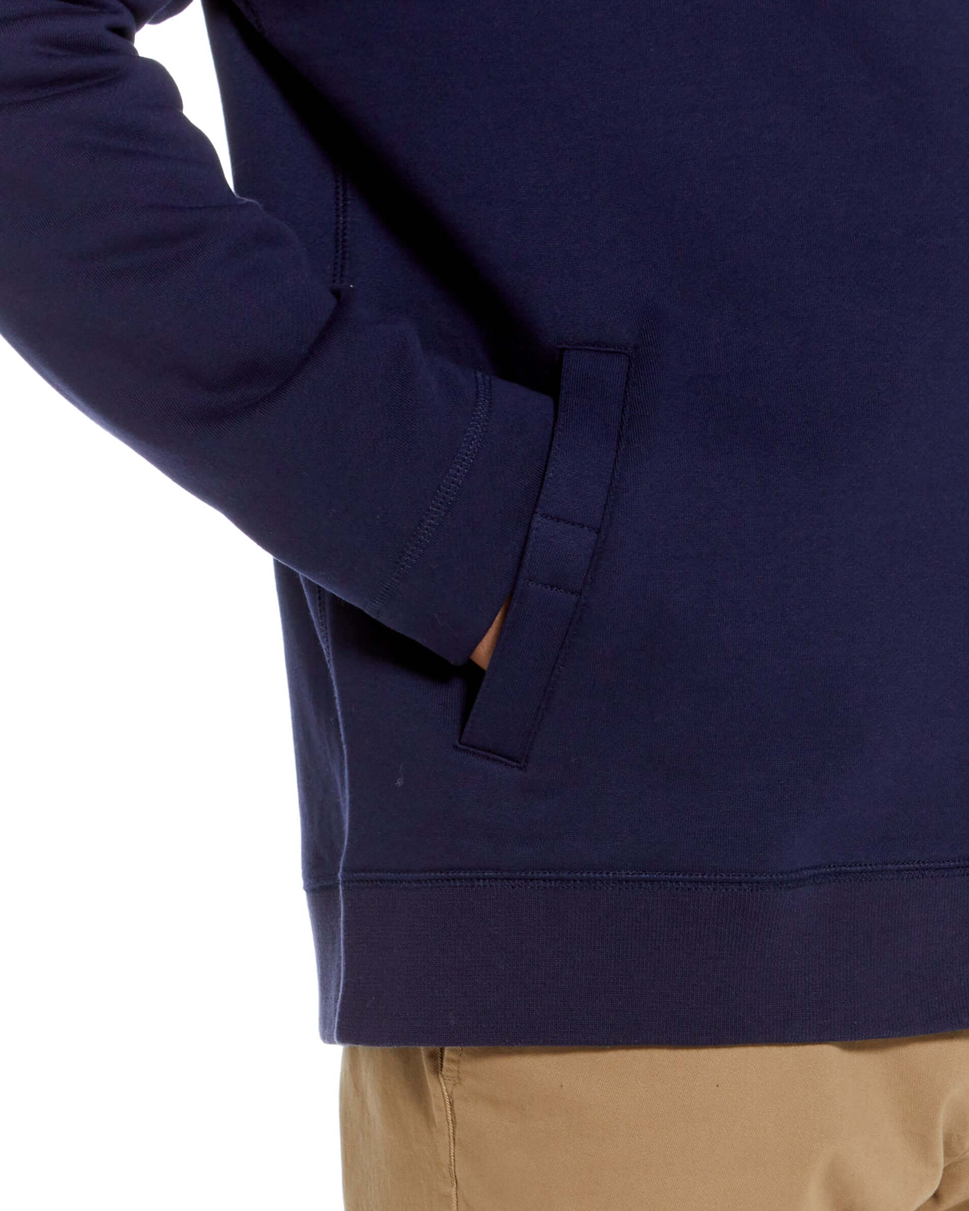 Close-up of navy knit fleece jacket with magnetic closures, featuring a comfortable fit and practical side pocket design.
