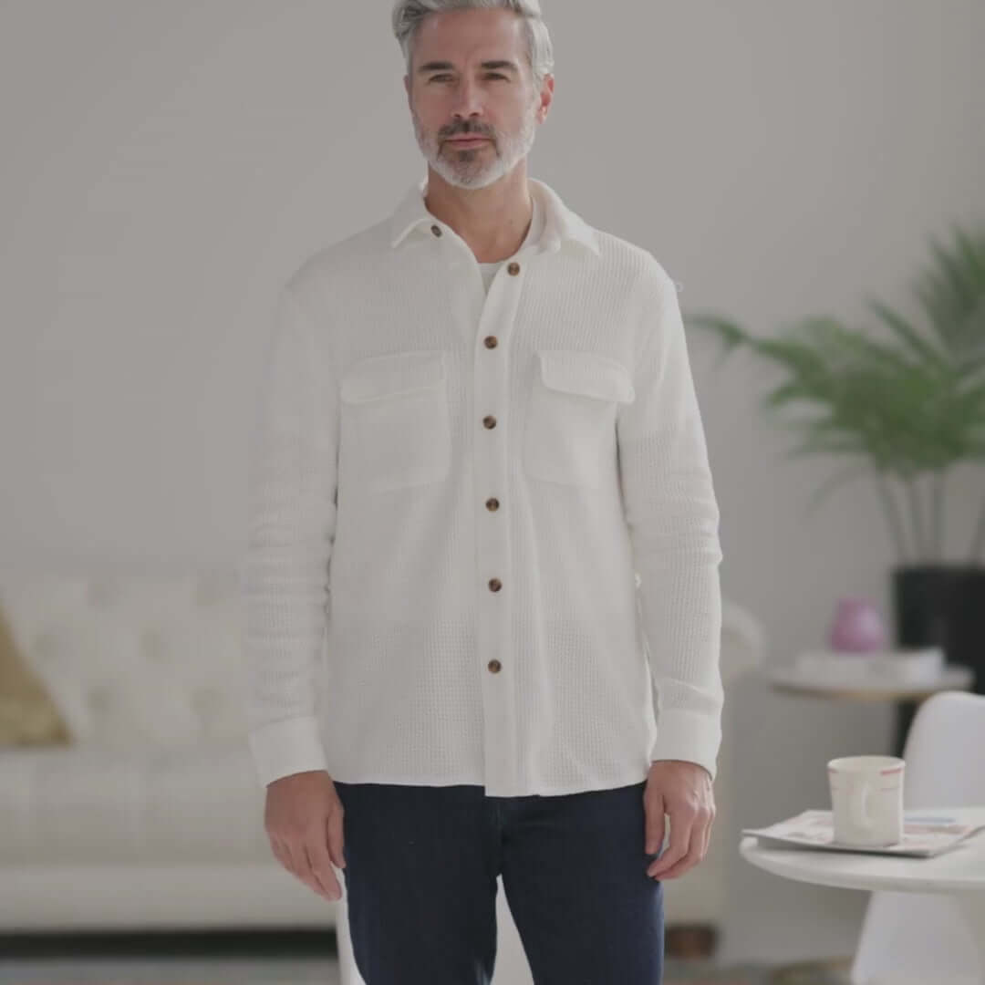 Man wearing a white Magnetic Front Waffle Weave Casual Shirt with dual oversized pockets, styled casually.