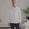 Man wearing a white Magnetic Front Waffle Weave Casual Shirt with dual oversized pockets, styled casually.