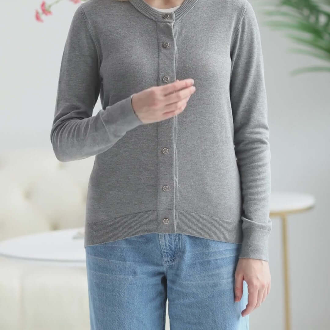 Woman wearing a grey adaptive magnetic front knit cardigan sweater, designed for easy dressing and comfort.