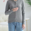 Woman wearing a grey adaptive magnetic front knit cardigan sweater, designed for easy dressing and comfort.