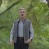 Man wearing MagnaReady® Reversible Diamond Quilted Magnetic Button Vest in outdoor setting, showcasing effortless style and comfort.