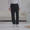 Man wearing Nautica® x MagnaReady® black adaptive dress pants with a white shirt and sneakers.