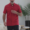 Red heather pique knit short sleeve polo shirt with magnetic closures, ideal for easy dressing and comfort.