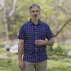 Adaptive Cooling Magnetic Front Short Sleeve Shirt in Navy Diamond worn by a man outdoors.