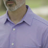 Adaptive Cooling Magnetic Front Short Sleeve Shirt in Pink and Blue Stripe worn by a model outdoors.