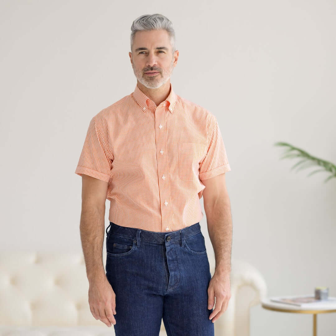 Short sleeve orange and white gingham shirt for men, featuring magnetic closures for easy wear.
