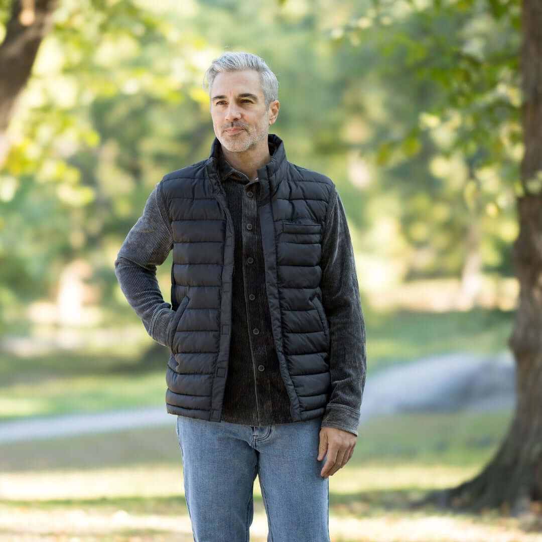 Weatherproof® X MagnaReady® Puffer Magnetic Front Black Vest worn by a man outdoors.