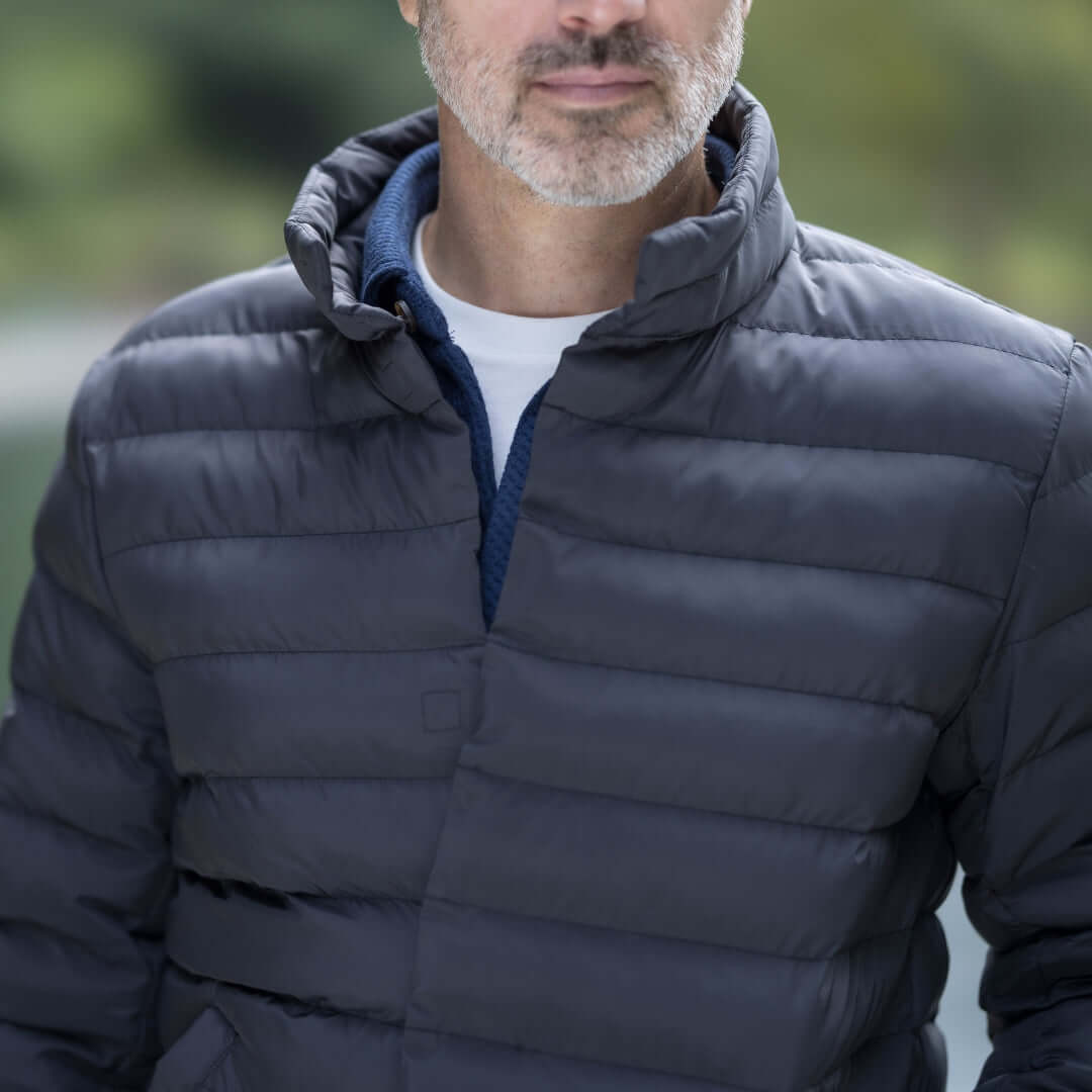 Weatherproof x MagnaReady navy puffer jacket featuring magnetic closure technology for effortless style and comfort.
